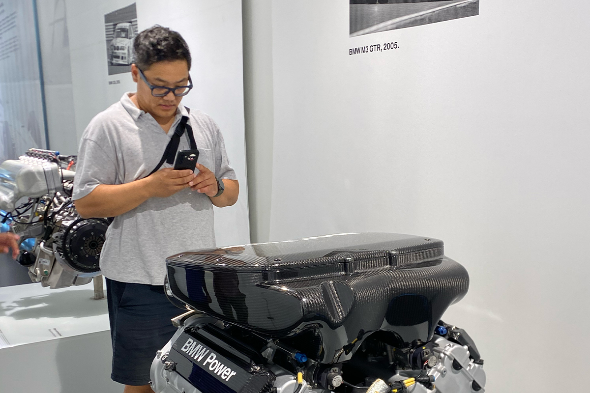 Jun touring an automotive facility in Munich, Germany